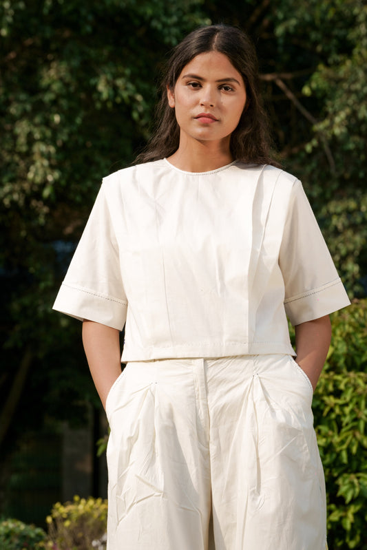 White Pleated Top at Kamakhyaa by Ahmev. This item is Casual Wear, Cotton, Crop Tops, July Sale, July Sale 2023, Natural, Regular Fit, Solids, Tops, White, Womenswear