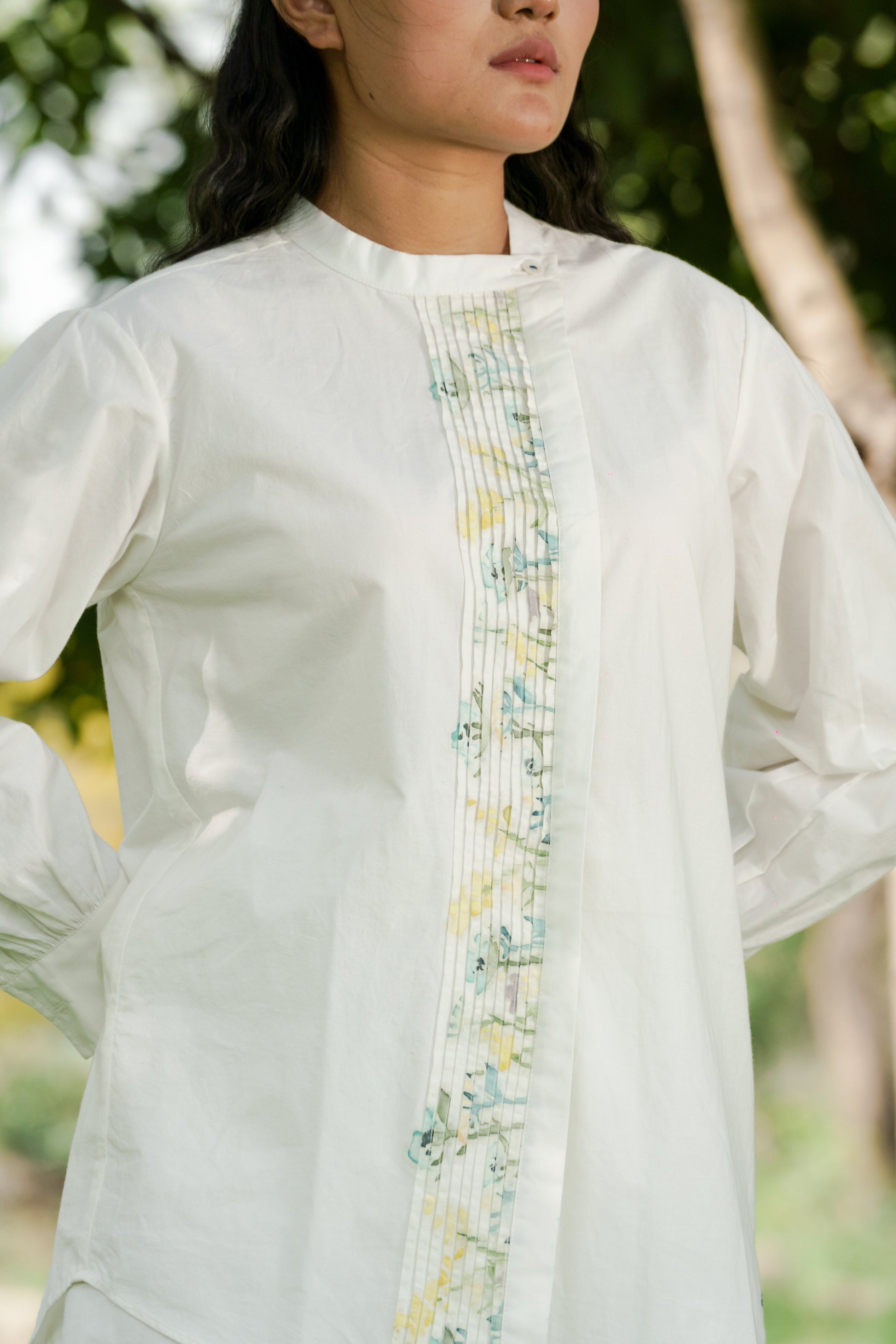 White Pleated placket shirt at Kamakhyaa by Ahmev. This item is Batik, Casual Wear, Cotton, Handpainted, July Sale, July Sale 2023, Natural, Prints, Regular Fit, Shirts, Tops, White, Womenswear