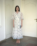 White Printed Cotton Maxi Dress at Kamakhyaa by Taro. This item is Evening Wear, Handwoven cotton, Indo-Western, July Sale, July Sale 2023, Maxi Dresses, Natural, Printed Selfsame, Prints, Regular Fit, Sitara Taro, White, Wildflower Taro, Womenswear, Wrap Dresses