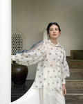 White Printed Cotton Shirt at Kamakhyaa by Taro. This item is Evening Wear, Handwoven cotton, Indo-Western, July Sale, July Sale 2023, Natural, Prints, Regular Fit, Shirts, White, Wildflower Taro, Womenswear