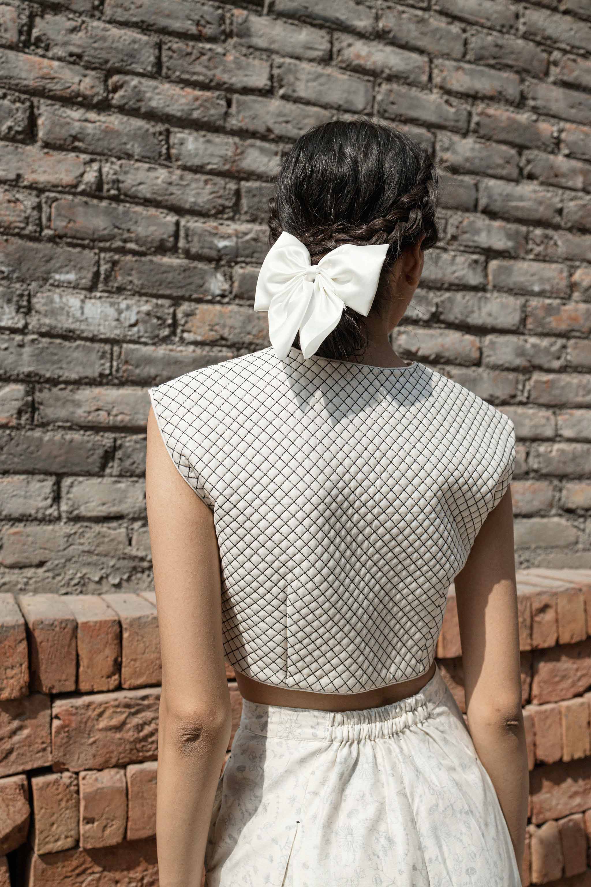 White Quilted Blouse at Kamakhyaa by Ahmev. This item is Best Selling, Casual Wear, Chanderi, Indian Wear, Ink And Ivory, Natural, Regular Fit, Saree Blouses, Textured, White, Womenswear