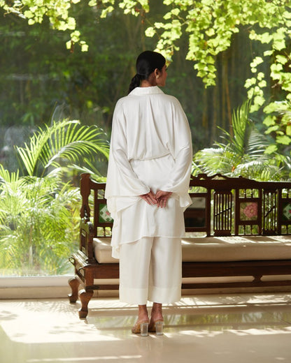 White Satin Silk Kaftan With Collar at Kamakhyaa by Mayura Kumar. This item is Ajrakh Heritage, Casual Wear, Dresses, Festive Wear, Kaftans, Mayura Kumar, Modal Silk, Relaxed Fit, Solids, White, Womenswear