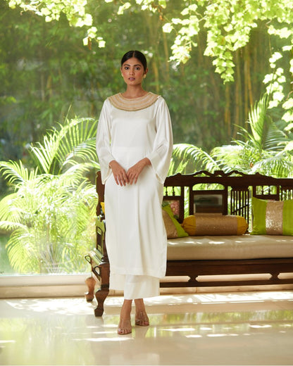 White Satin Silk Kurta Pant Set at Kamakhyaa by Mayura Kumar. This item is Casual Wear, Festive Wear, Kurta Pant Sets, Mayura Kumar, Regular Fit, Satin, Silk, Solids, Timeless Elegance, White, Womenswear