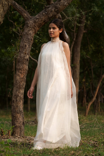 White Silk Organza & Sheer Long Dress at Kamakhyaa by Ahmev. This item is Casual Wear, Cotton, FB ADS JUNE, Fitted At Waist, Halter Neck Dresses, July Sale, July Sale 2023, Maxi Dresses, Natural, Silk Organza, Solids, White, Womenswear