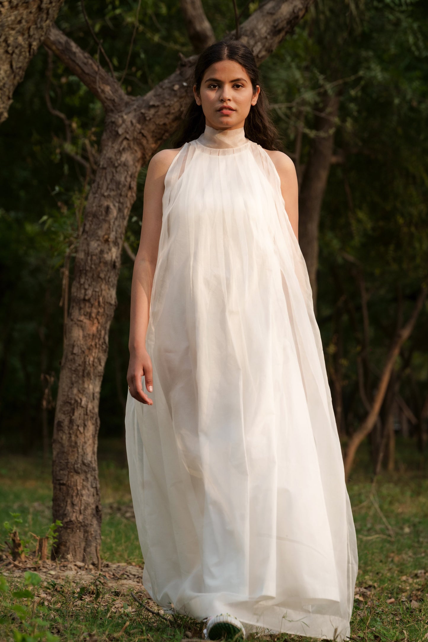 White Silk Organza & Sheer Long Dress at Kamakhyaa by Ahmev. This item is Casual Wear, Cotton, FB ADS JUNE, Fitted At Waist, Halter Neck Dresses, July Sale, July Sale 2023, Maxi Dresses, Natural, Silk Organza, Solids, White, Womenswear