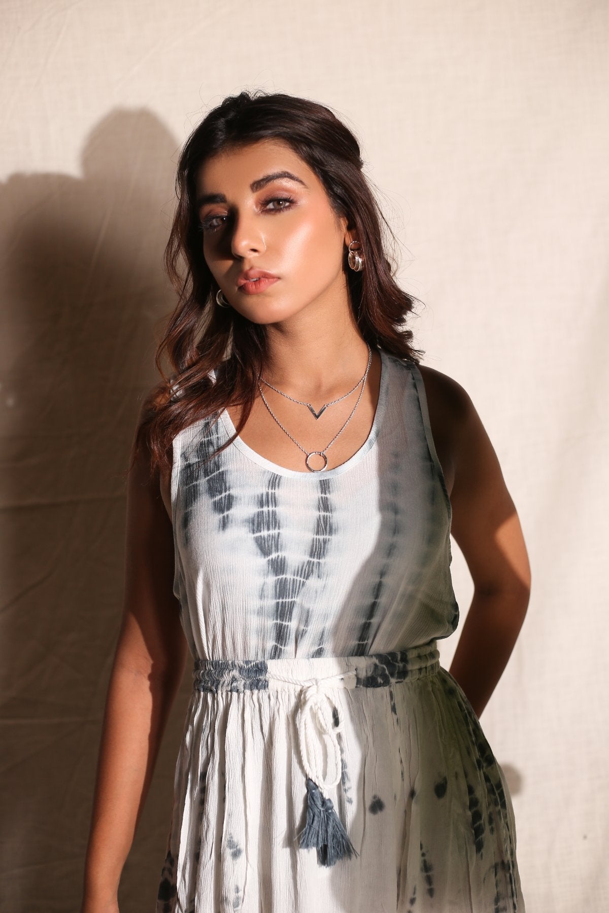 White Skirt And Top- Set of Two at Kamakhyaa by Keva. This item is Best Selling, Co-ord Sets, Crepe, Day Dream, Lounge Wear Co-ords, Natural, Rayon, Relaxed Fit, Resort Wear, Skirt Sets, Tie & Dye, Vacation Co-ords, White, Womenswear