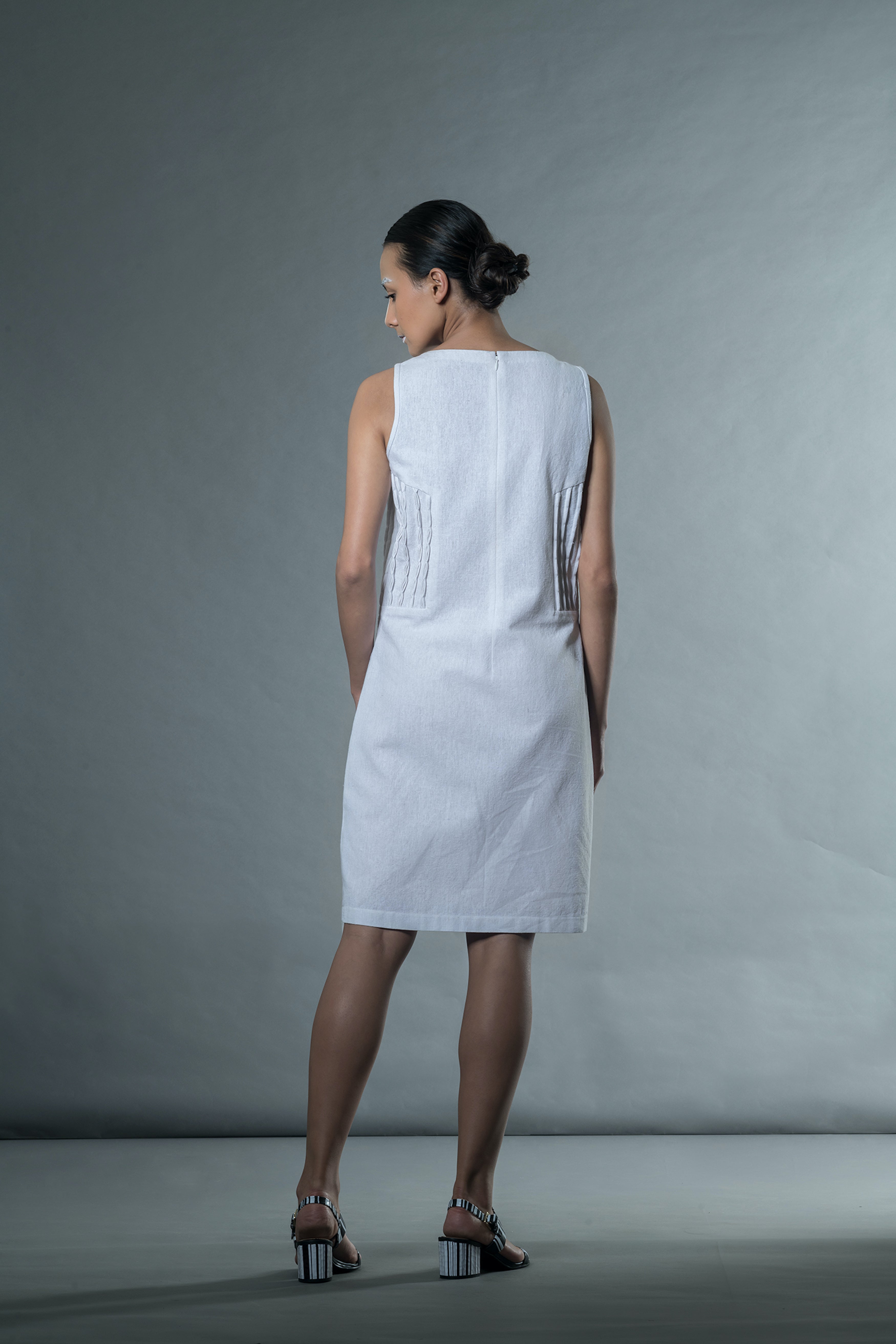 White Sleeveless Mini Dress at Kamakhyaa by Anushé Pirani. This item is Easter, Handwoven Jute Cotton, July Sale, July Sale 2023, Mini Dresses, Natural, Office Wear, Playful Office Wear, Relaxed Fit, sale anushe pirani, Sleeveless Dresses, Solids, The Line Tales, White, Womenswear