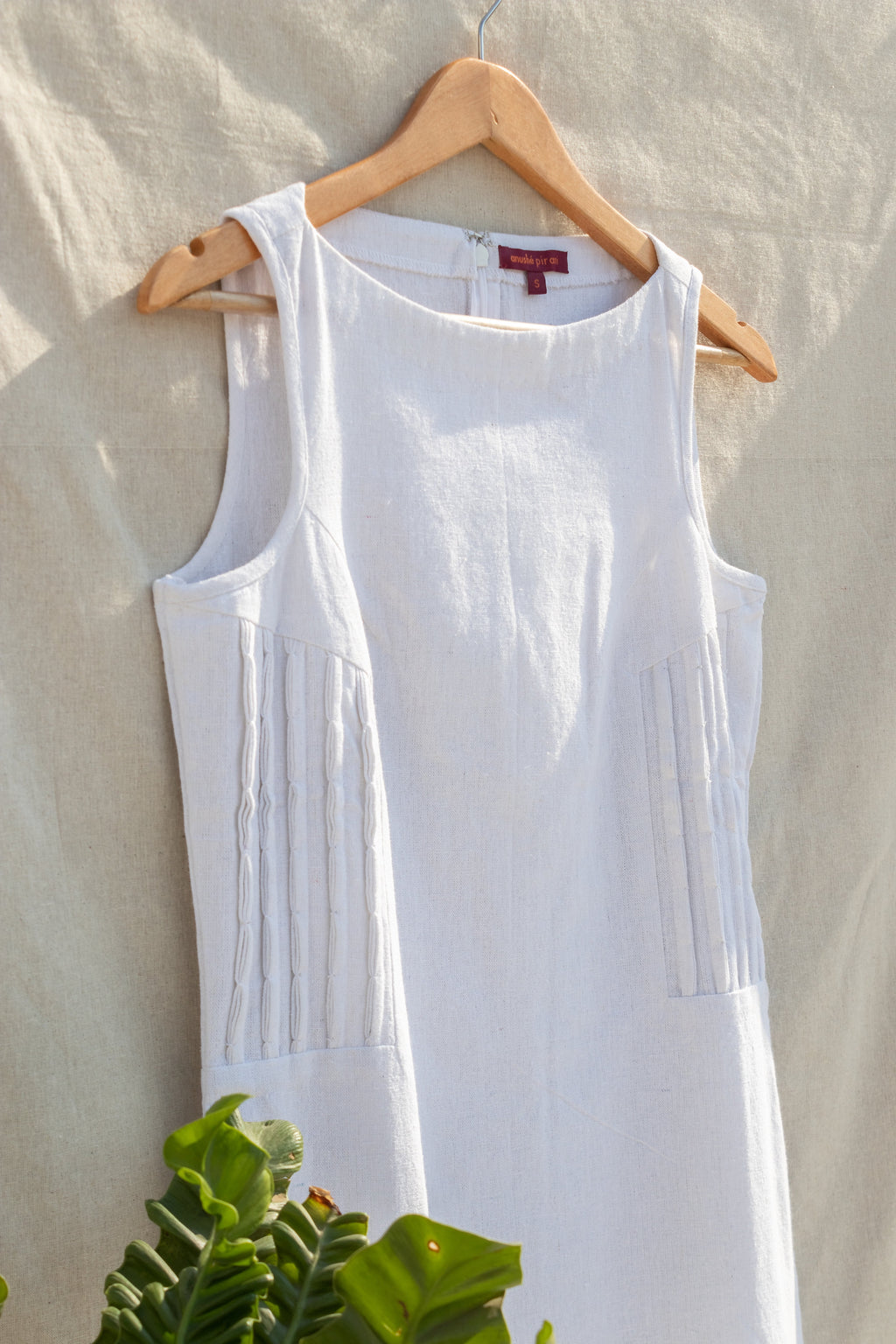 White Sleeveless Mini Dress at Kamakhyaa by Anushé Pirani. This item is Easter, Handwoven Jute Cotton, July Sale, July Sale 2023, Mini Dresses, Natural, Office Wear, Playful Office Wear, Relaxed Fit, sale anushe pirani, Sleeveless Dresses, Solids, The Line Tales, White, Womenswear