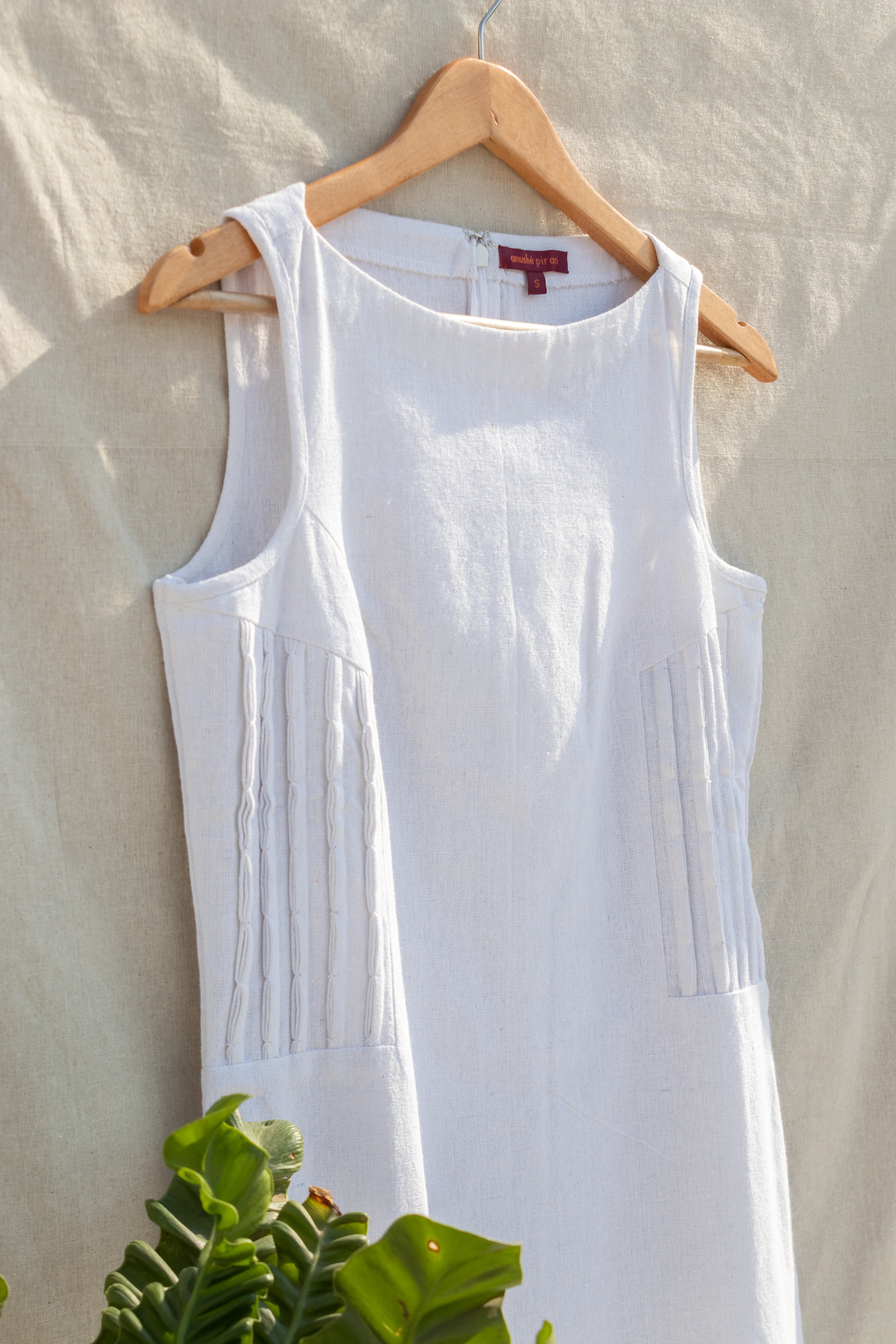 White Sleeveless Mini Dress at Kamakhyaa by Anushé Pirani. This item is Easter, Handwoven Jute Cotton, July Sale, July Sale 2023, Mini Dresses, Natural, Office Wear, Playful Office Wear, Relaxed Fit, sale anushe pirani, Sleeveless Dresses, Solids, The Line Tales, White, Womenswear