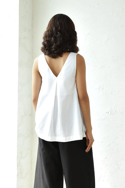 White Sleeveless V Neck Top With Black Flared Pant Set at Kamakhyaa by Canoopi. This item is Black, Canoopi, Casual Wear, Complete Sets, Natural, Poplin, Regular Fit, Solids, Vacation Co-ords, White, Womenswear