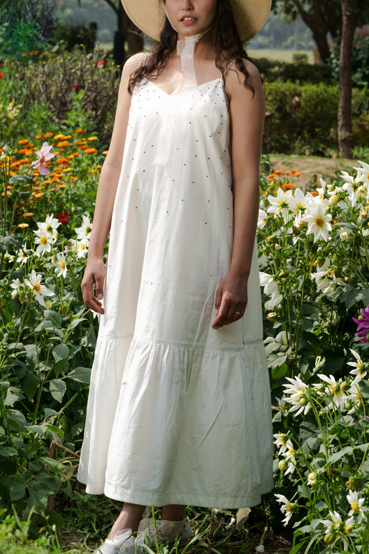 White Strap Maxi Dress at Kamakhyaa by Ahmev. This item is Casual Wear, Cotton, July Sale, July Sale 2023, Maxi Dresses, Natural, Relaxed Fit, Sleeveless Dresses, Solids, Strap Dresses, Tiered Dresses, White, Womenswear