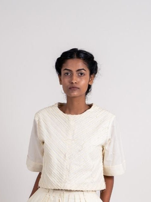 White Textured Crop Top at Kamakhyaa by Ahmev. This item is Casual Wear, Crop Tops, Handloom Cotton, Highend fashion, July Sale, July Sale 2023, Natural, Regular Fit, Textured, Tops, White, Womenswear