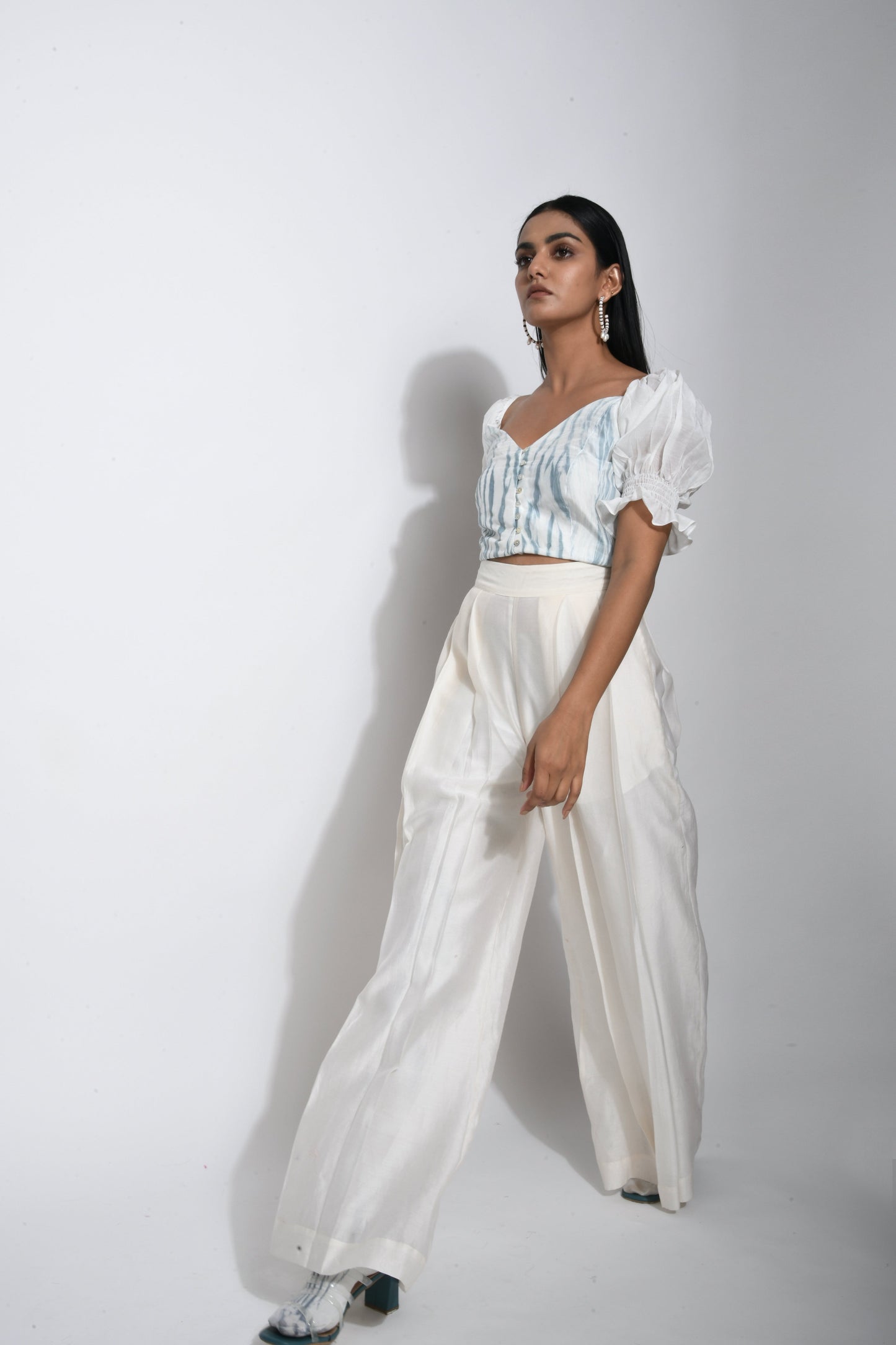 White Textured Crop Top at Kamakhyaa by The Loom Art. This item is Best Selling, Between the Lines, Crop Tops, Handwoven silk, July Sale, July Sale 2023, Natural, Party Wear, Printed Selfsame, Regular Fit, Textured, Tops, White, Womenswear