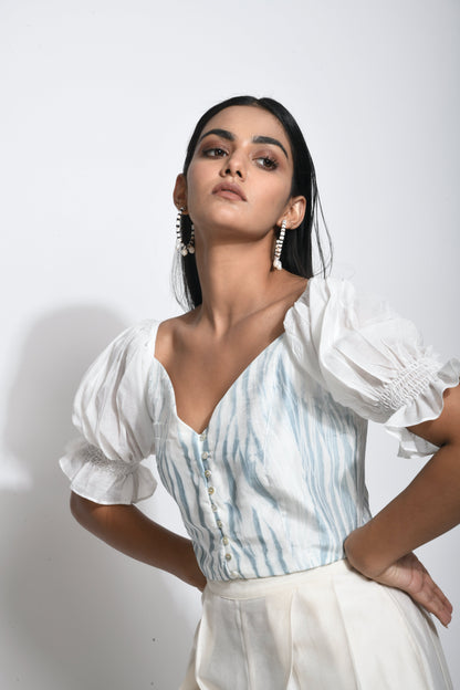 White Textured Crop Top at Kamakhyaa by The Loom Art. This item is Best Selling, Between the Lines, Crop Tops, Handwoven silk, July Sale, July Sale 2023, Natural, Party Wear, Printed Selfsame, Regular Fit, Textured, Tops, White, Womenswear
