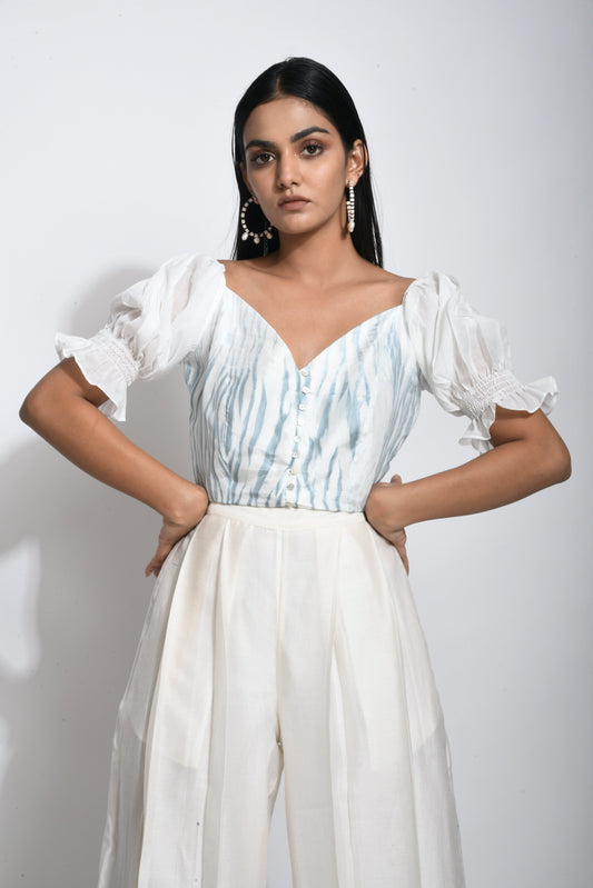 White Textured Crop Top at Kamakhyaa by The Loom Art. This item is Best Selling, Between the Lines, Crop Tops, Handwoven silk, July Sale, July Sale 2023, Natural, Party Wear, Printed Selfsame, Regular Fit, Textured, Tops, White, Womenswear