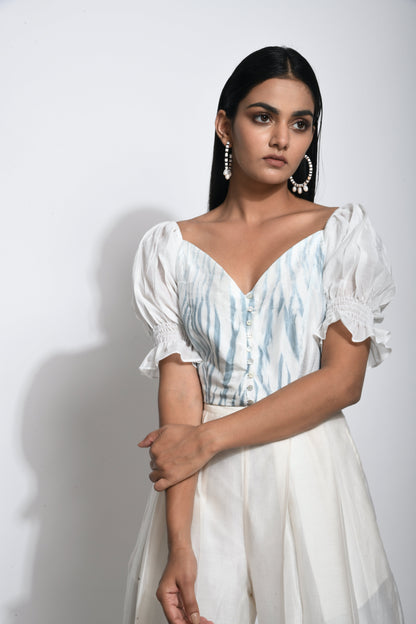 White Textured Crop Top at Kamakhyaa by The Loom Art. This item is Best Selling, Between the Lines, Crop Tops, Handwoven silk, July Sale, July Sale 2023, Natural, Party Wear, Printed Selfsame, Regular Fit, Textured, Tops, White, Womenswear