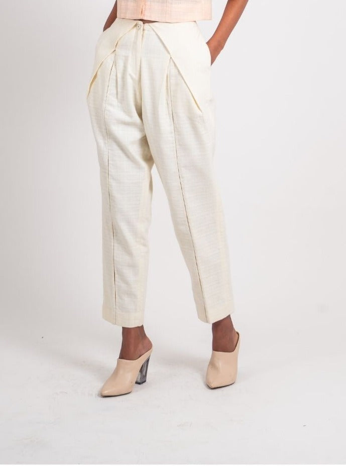 White Textured Pleated Pant at Kamakhyaa by Ahmev. This item is Casual Wear, Fitted At Waist, Handloom Cotton, Highend fashion, July Sale, July Sale 2023, Natural, Solids, Trousers, White, Womenswear