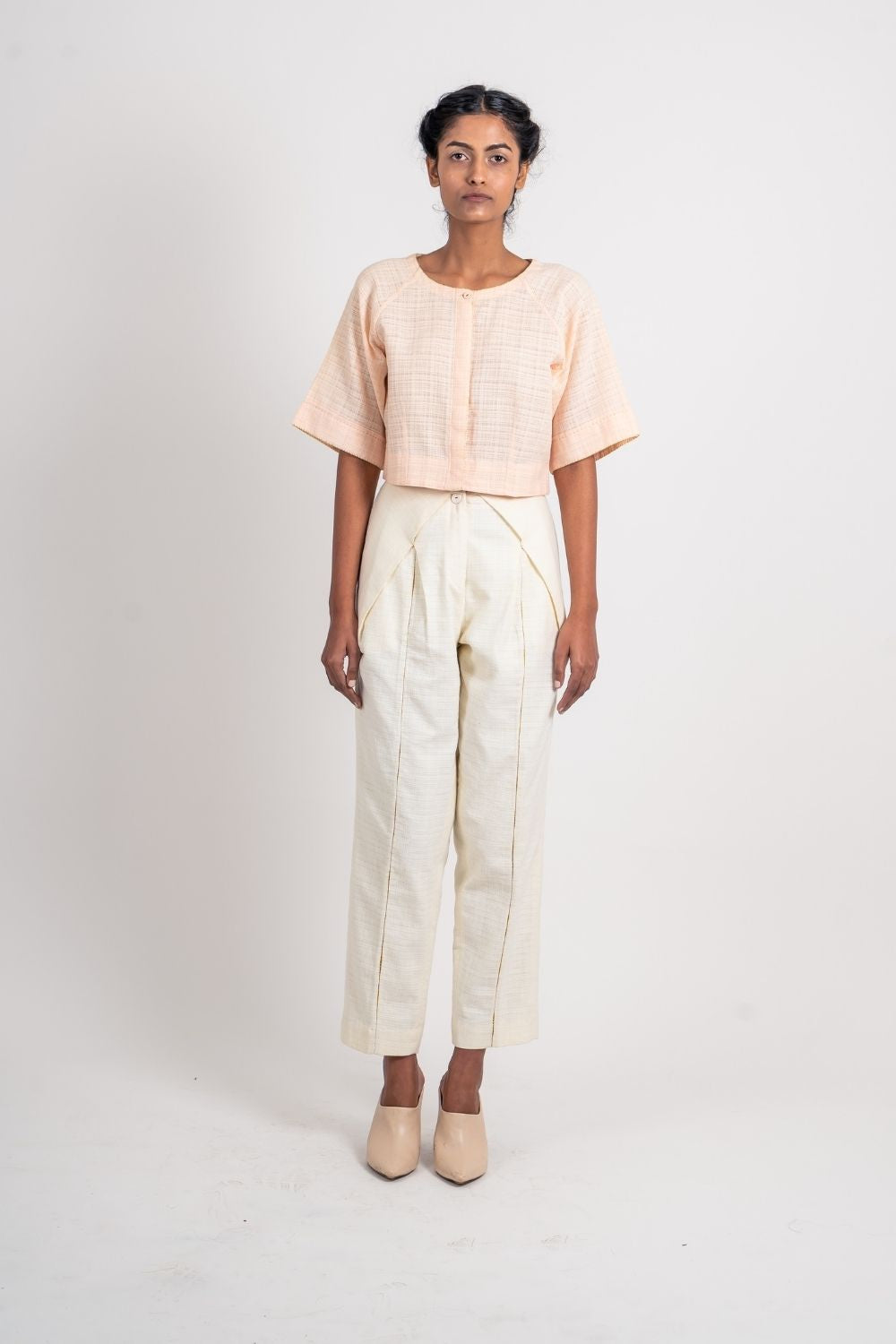 White Textured Pleated Pant at Kamakhyaa by Ahmev. This item is Casual Wear, Fitted At Waist, Handloom Cotton, Highend fashion, July Sale, July Sale 2023, Natural, Solids, Trousers, White, Womenswear