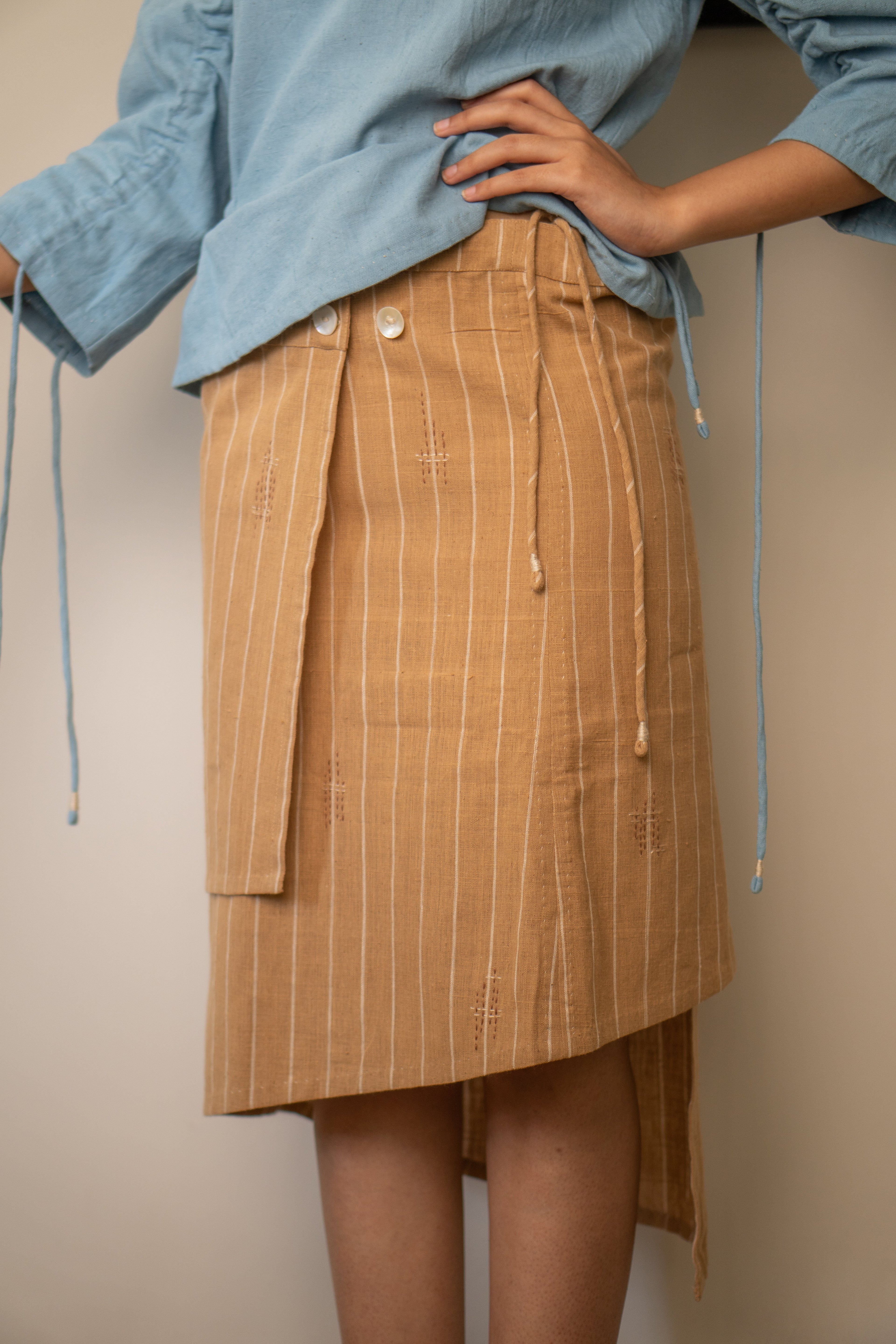 Wrap Around Skirt at Kamakhyaa by Lafaani. This item is 100% pure cotton, Brown, Casual Wear, Materiality, Organic, Regular Fit, Skirts, Solids, Undyed and Unbleached, Womenswear