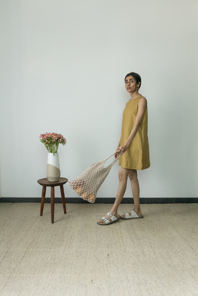 Yellow Flowy Mini Dress at Kamakhyaa by Anushé Pirani. This item is Casual Wear, Cotton, Cotton Hemp, Handwoven, Hemp, Mini Dresses, Regular Fit, Shibumi Collection, Sleeveless Dresses, Solids, Womenswear, Yellow