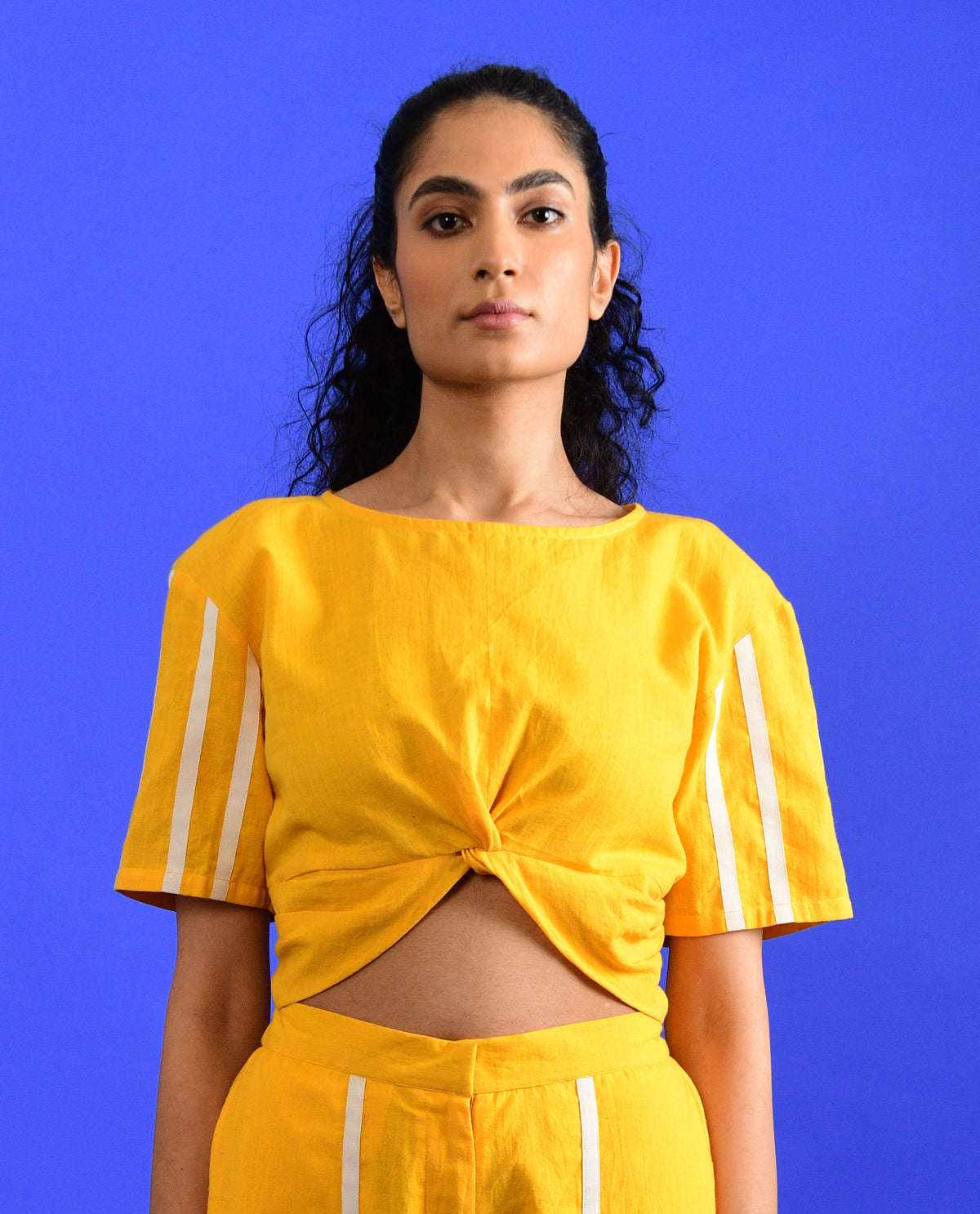 Yellow Knotted Crop Top at Kamakhyaa by Rias Jaipur. This item is Casual Wear, Crop Tops, Handloom Cotton, Handspun, Handwoven, Hue, Regular Fit, Solids, Stripes, Womenswear, Yellow