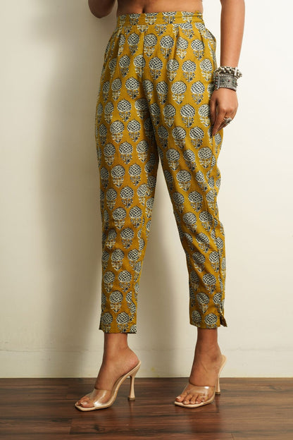 Yellow Printed Cotton Straight Pant at Kamakhyaa by Keva. This item is 100% cotton, Best Selling, Capris, Fusion Wear, Less than $50, Natural, New, Prints, Products less than $25, Regular Fit, Saba, Womenswear, Yellow