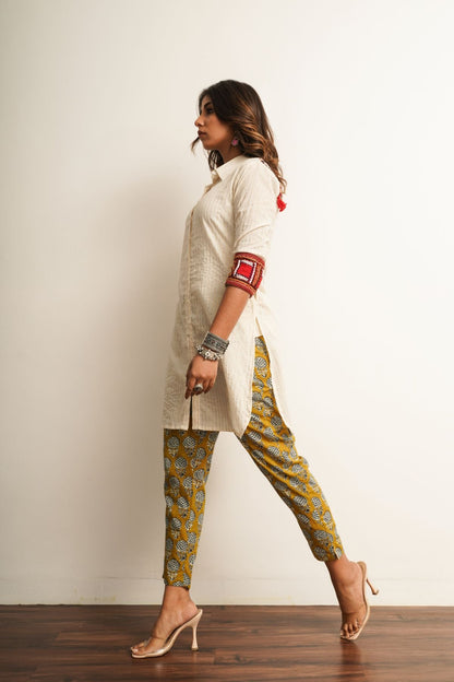 Yellow Printed Cotton Straight Pant at Kamakhyaa by Keva. This item is 100% cotton, Best Selling, Capris, Fusion Wear, Less than $50, Natural, New, Prints, Products less than $25, Regular Fit, Saba, Womenswear, Yellow