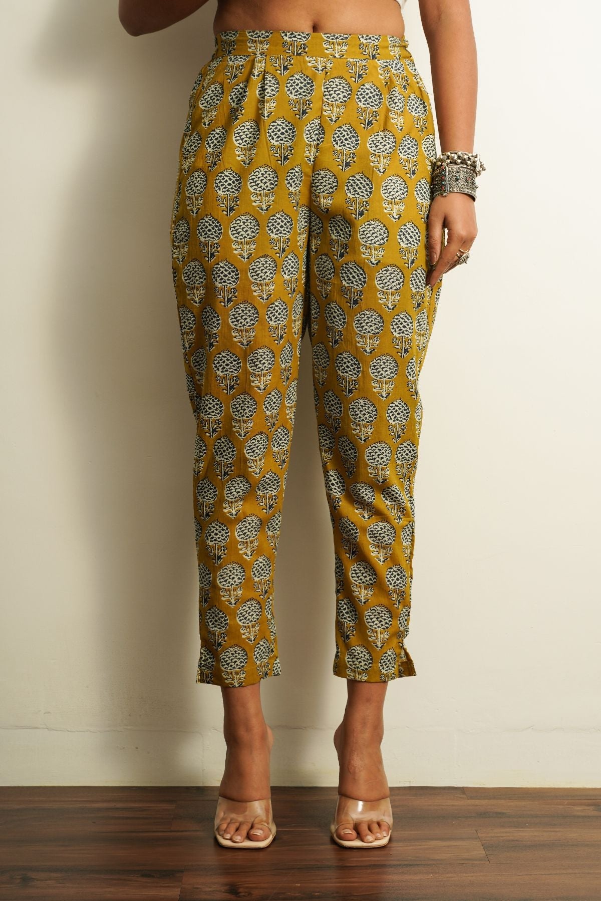 Yellow Printed Cotton Straight Pant at Kamakhyaa by Keva. This item is 100% cotton, Best Selling, Capris, Fusion Wear, Less than $50, Natural, New, Prints, Products less than $25, Regular Fit, Saba, Womenswear, Yellow