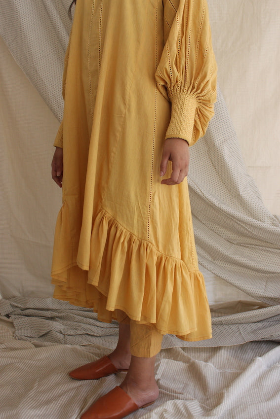 Yellow Ruffled Full Sleeves Dress at Kamakhyaa by Chambray & Co.. This item is Casual Wear, Cotton, Midi Dresses, Natural, Regular Fit, Ruffle Dresses, Solids, Tiered Dresses, Womenswear, Yellow