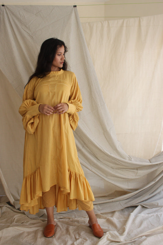 Yellow Ruffled Full Sleeves Dress at Kamakhyaa by Chambray & Co.. This item is Casual Wear, Cotton, Midi Dresses, Natural, Regular Fit, Ruffle Dresses, Solids, Tiered Dresses, Womenswear, Yellow