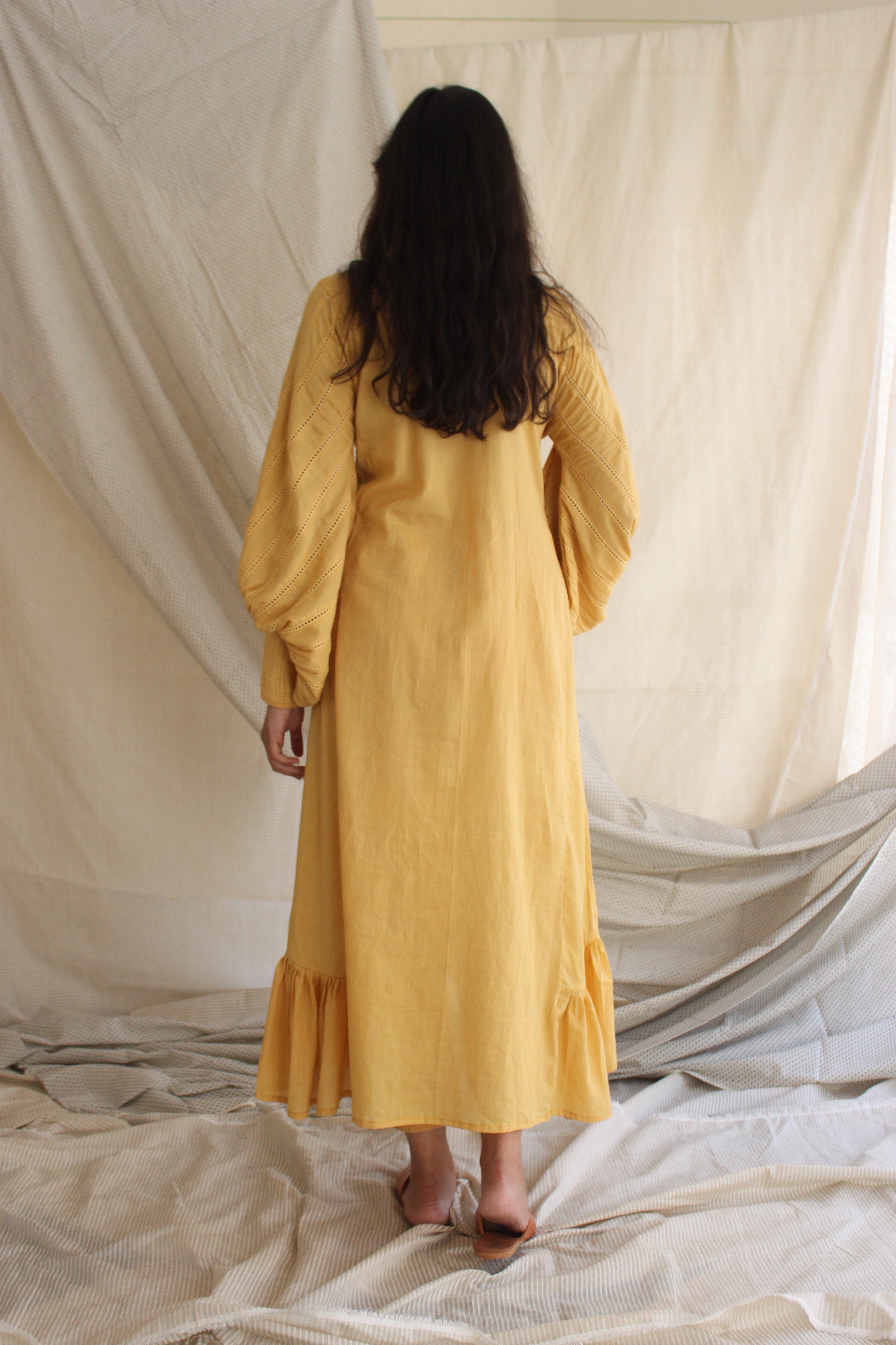 Yellow Ruffled Full Sleeves Dress at Kamakhyaa by Chambray & Co.. This item is Casual Wear, Cotton, Midi Dresses, Natural, Regular Fit, Ruffle Dresses, Solids, Tiered Dresses, Womenswear, Yellow