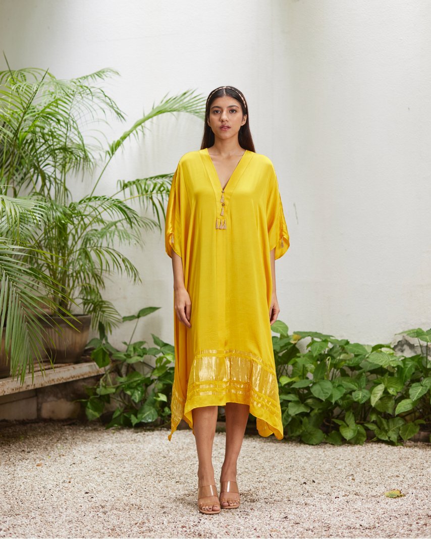 Yellow Silk Kaftan With Golden Border at Kamakhyaa by Mayura Kumar. This item is Ajrakh Heritage, Casual Wear, Dresses, Festive Wear, Kaftans, Mayura Kumar, Modal Silk, Relaxed Fit, Solids, Womenswear, Yellow