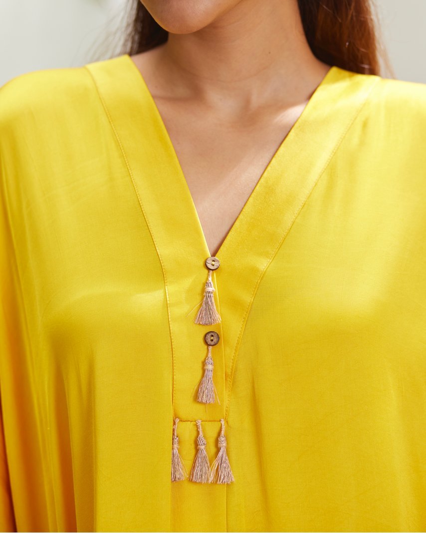 Yellow Silk Kaftan With Golden Border at Kamakhyaa by Mayura Kumar. This item is Ajrakh Heritage, Casual Wear, Dresses, Festive Wear, Kaftans, Mayura Kumar, Modal Silk, Relaxed Fit, Solids, Womenswear, Yellow