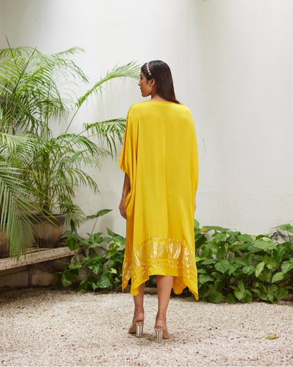 Yellow Silk Kaftan With Golden Border at Kamakhyaa by Mayura Kumar. This item is Ajrakh Heritage, Casual Wear, Dresses, Festive Wear, Kaftans, Mayura Kumar, Modal Silk, Relaxed Fit, Solids, Womenswear, Yellow