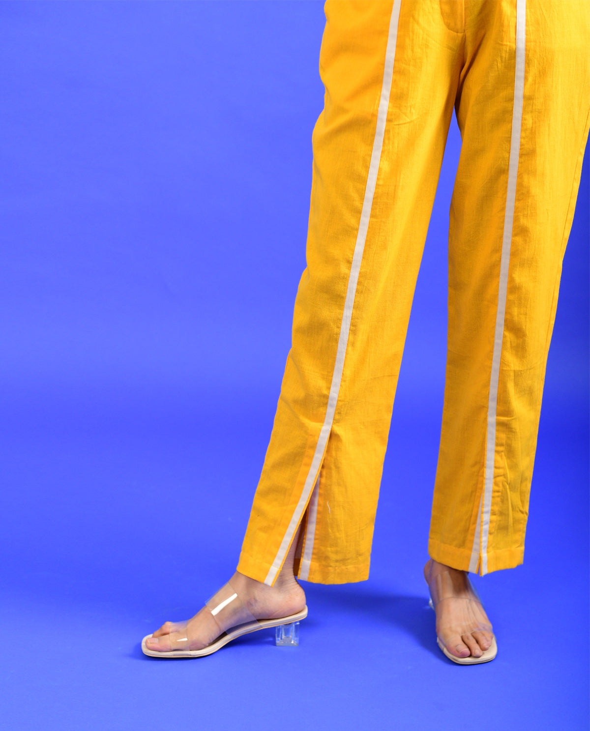 Yellow Solid Pants at Kamakhyaa by Rias Jaipur. This item is Casual Wear, Handloom Cotton, Handspun, Handwoven, Hue, Pants, Regular Fit, Solids, Stripes, Womenswear, Yellow